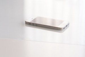 image of gold iPhone on white tabletop