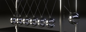 Monochrome image of silver Newton's cradle balls with dark background
