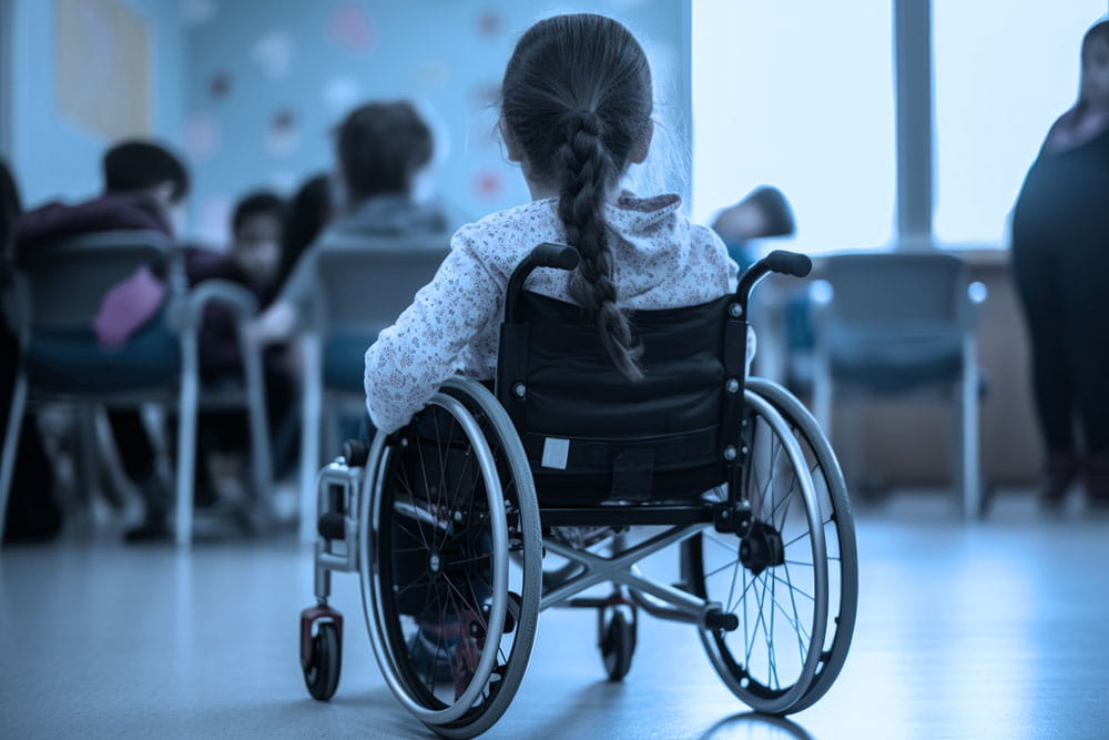 child in wheelchair - image from behind